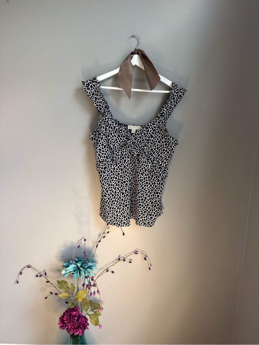 Women's black and white animal print ruffled top
